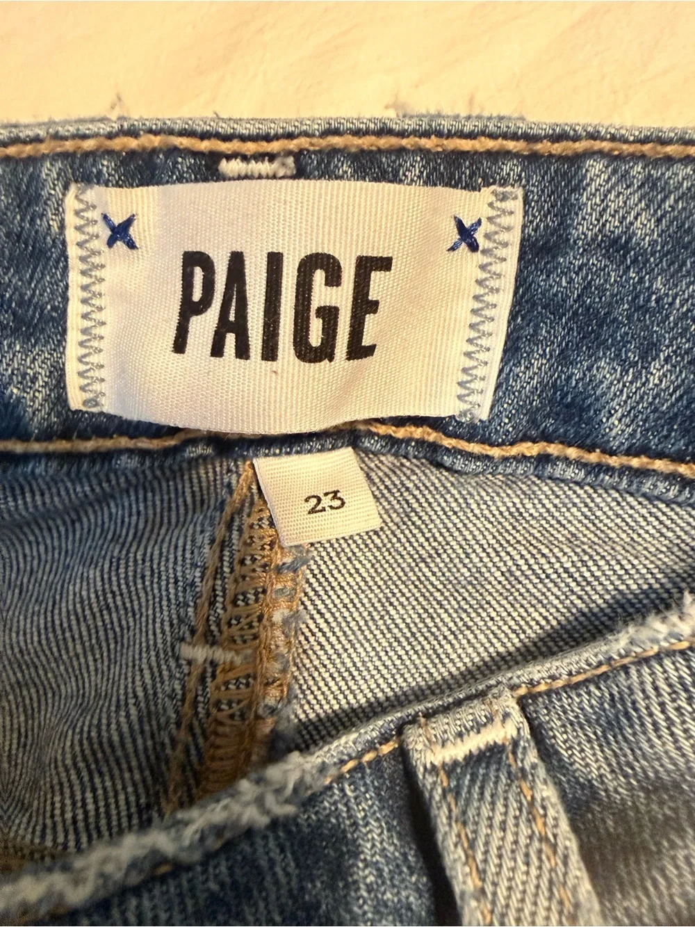 PAIGE Medium Blue Skinny Jeans with Frayed Hem